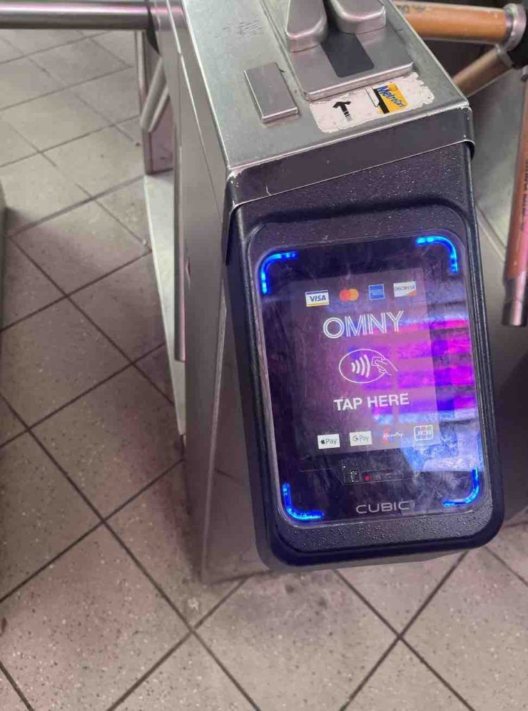 You don't need to buy a paper ticket any more to ride a New York City train - you can just tap your Apple Pay or credit card on this machine.