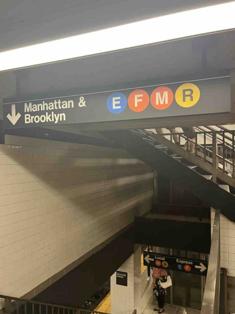 Follow the subway station signs - first the big white letters, then the colorful circles second.